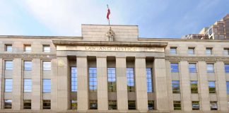TRUMP DEFIED — Judge DROPS Media BOMB Facade of a government building with the words Law and Justice and a statue on top