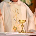Vatican BOMBSHELL — Were Those WEDDINGS FAKE? A priest holding a golden chalice during a religious ceremony