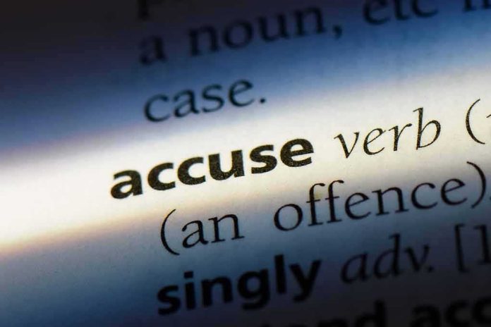 shutterstock_1067759465 dictionary entry highlighting the word accuse
