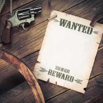 Bounties on ICE AGENTS POSTED — The TWIST He DIDN’T SEE COMING! A vintage wanted poster alongside a revolver and rope on a wooden table