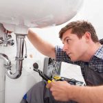 TWISTED! — Home Repair Visit Ends In DEATH A plumber working under a sink with tools
