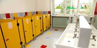 RADICAL Obama Judge’s TWISTED Title IX RULING Children's restroom with yellow stalls and white sinks