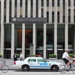 MAMDANI Has LOST HIS MIND — See What HE POSTED! News Corporation building entrance with NYPD car and cyclists