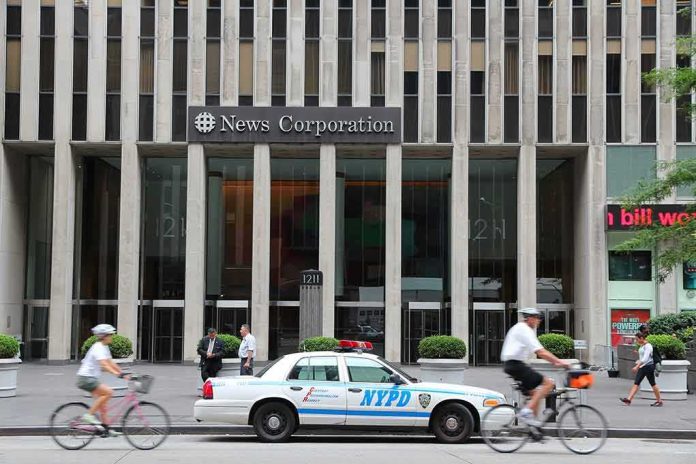 News Corporation building entrance with NYPD car and cyclists