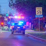 Crowd PANICS, Child SHOT — SHOOTER On The Run Emergency vehicles with flashing lights on a city street at night
