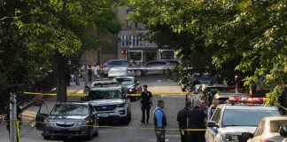 Road-Rage NIGHTMARE — Gun Pulled On TEENS Police officers secure a residential street with patrol cars and yellow tape