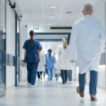 Major HOSPITAL EXPOSED — UNTHINKABLE Practices! Medical staff walking through a hospital corridor