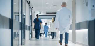 Major HOSPITAL EXPOSED — UNTHINKABLE Practices! Medical staff walking through a hospital corridor