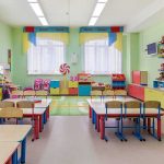 SHOCKING! — Walz Backs SWAPPABLE GENITALS’ Doll Colorful kindergarten classroom with tables and chairs