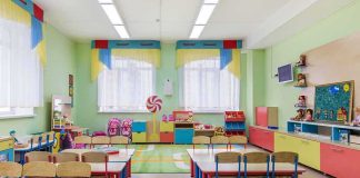 Colorful kindergarten classroom with tables and chairs