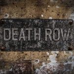 Rapper Condemned to DEATH! Rusty metal sign on worn concrete wall