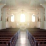 Church Horror STUNS County Empty church interior with sunlight at the altar