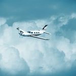 Shocking Mid-Flight SUICIDE Stuns Trainee Small turboprop airplane flying through cloudy sky