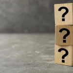 THESE BLURRY Answers Shadows New Spy Boss Three wooden blocks with question marks stacked.
