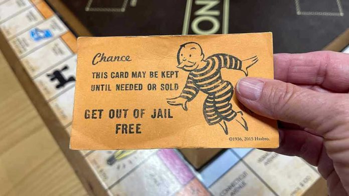 1908712006 Monopoly game card get out of jail free