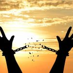 Convicted Clerk Walks — FREEDOM But No INNOCENCE Silhouette hands breaking chains at sunset