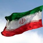 Iranian flag waving on a pole