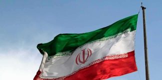Iran War HITS Classrooms — Children PRICED OUT of School Iranian flag waving on a pole