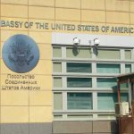 Embassy Alerts — GET OUT NOW! United States Embassy exterior with signage and seal