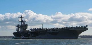 Overboard ALARMS Rock Carrier Aircraft carrier at sea with fighter jets on deck