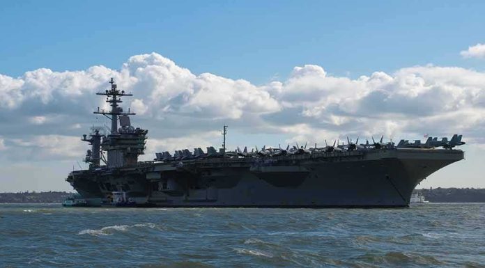 Aircraft carrier at sea with fighter jets on deck