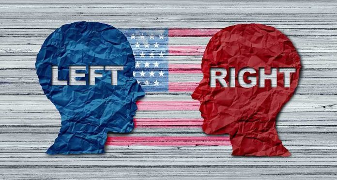 Blue and red paper head silhouettes facing each other over a faded U.S. flag