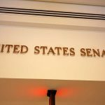 Bombshell POLICE REPORT Shadows SENATE Contender Sign displaying United States Senate in a government building