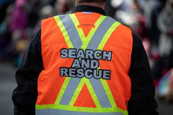 shutterstock_1576127386 Search and rescue worker in orange reflective vest