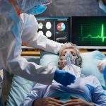 Patient on hospital bed with oxygen mask