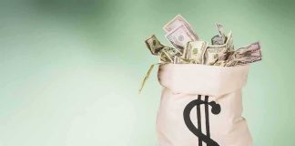 $13 Billion Beast Finally Moves — MAJOR Feat! Money bag overflowing with US dollar bills on green background