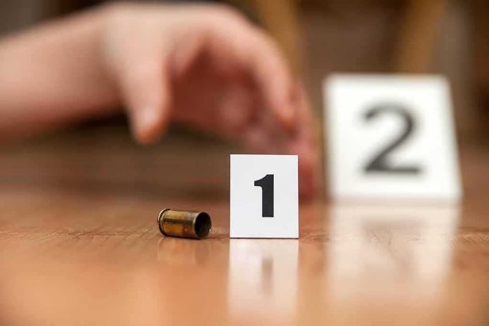 shutterstock_183376400 Bullet casing beside evidence marker 1 on floor
