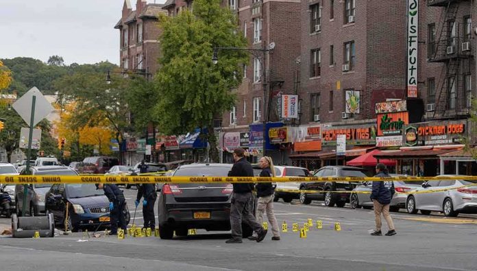 Police investigate a taped-off urban street crime scene