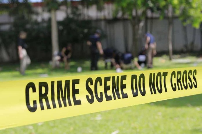crime scene tape cordoning off a grassy area