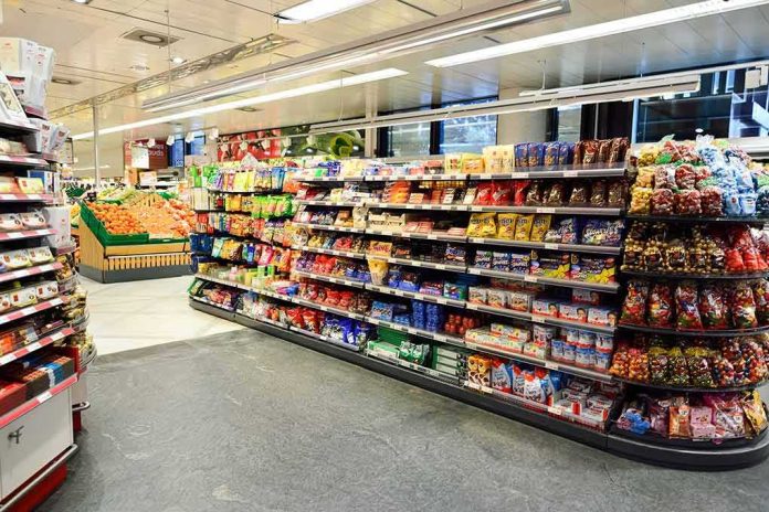 shutterstock_350642780 Supermarket aisle with shelves of snacks and candy