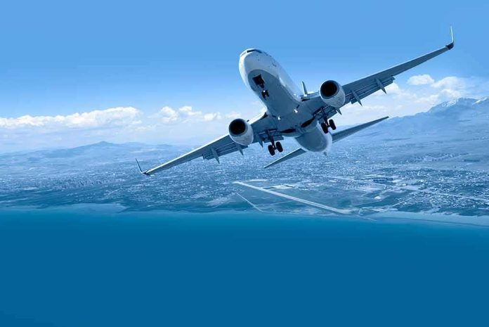 shutterstock_382266112 Commercial airplane banking over coastline