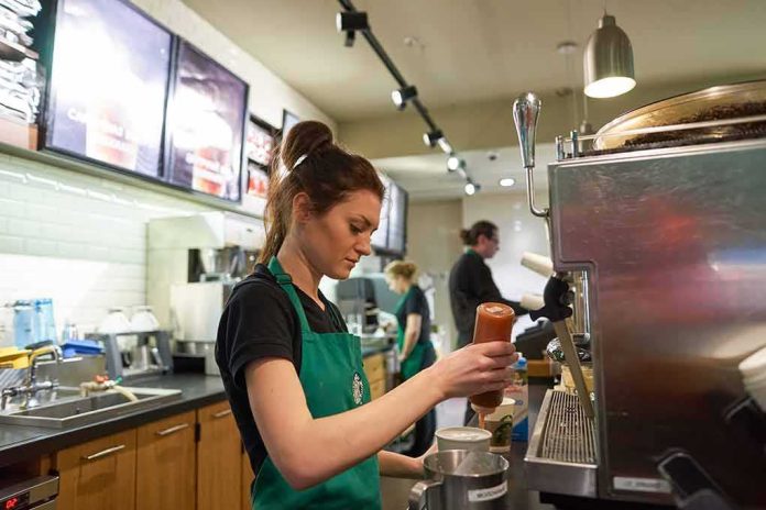 shutterstock_404561860 Barista preparing a drink at a coffee shop counter