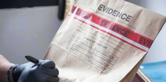 The LEFT is MELTING Over ICE’S Latest Purchase Gloved hands labeling a sealed evidence bag