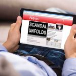 Judge Scandal EXPLODES — IMPEACHMENT Moves Fast Person holding a tablet showing a news website