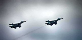 MAJOR NEWS — U.S. Jet Downed Over Iran Two military fighter jets flying in formation under cloudy sky