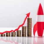 Bond Spike Screams — 2007 All Over AGAIN? Stacks of coins with upward arrow and red rocket