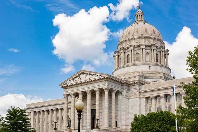 Neoclassical capitol building with large dome and columns under a blue sky
