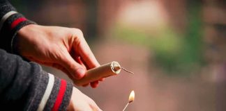 Fireworks Killed A Young Man — Feds Say Someone LIED Hands lighting a firework fuse with a match