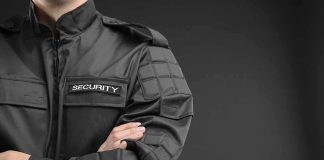 security guard in black uniform with crossed arms