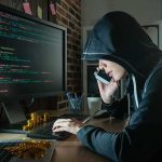 She Called A Murdered Boy’s Father — What She Said Was CHILLING Person in hoodie using computer and phone at desk