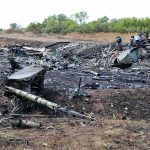 AGING BOMBER Explodes — HORRIFIC Details Airplane crash debris scattered across a burned field