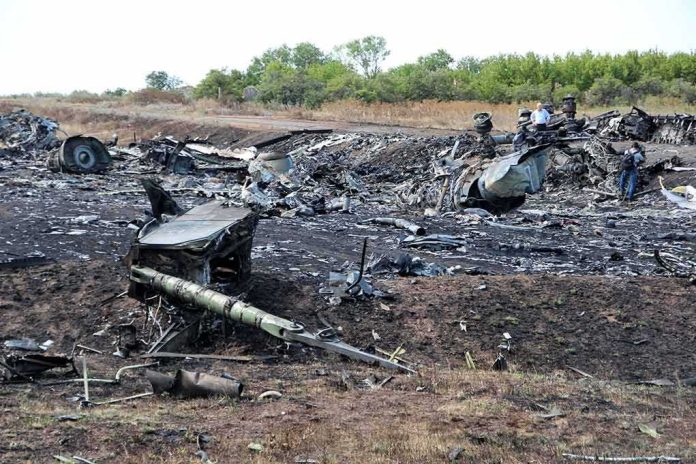 shutterstock_1344899717 Airplane crash debris scattered across a burned field