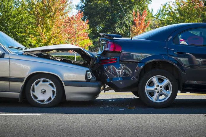 shutterstock_157986236 Two cars in a rear-end collision on a city street