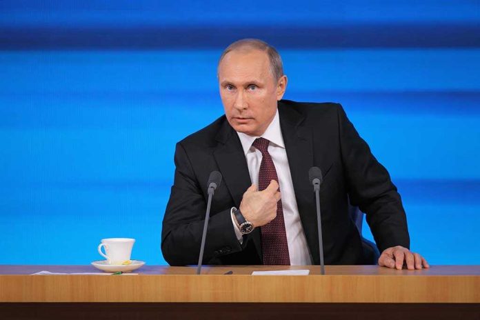 shutterstock_169177496 Vladimir Putin at a podium with two microphones