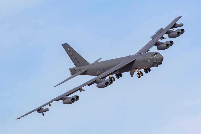 Military bomber aircraft banking in flight