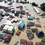 A Month Of Rain Fell In A Few HOURS — Not Everyone Got OUT Aerial view of flooded residential neighborhood